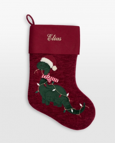 Julestrømpe med brodert navn og motiv av en julete dinosaur