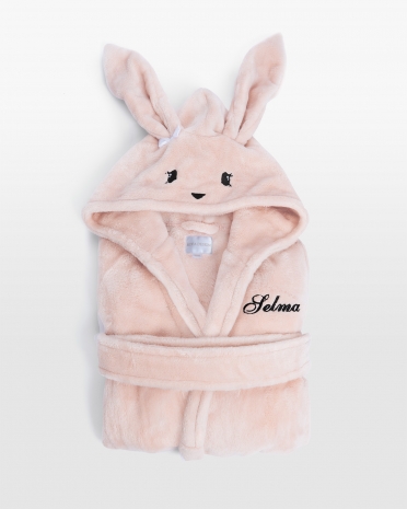 Søt rosa barnebadekåpe med kaninhette og personlig broderi, perfekt for koselig komfort og leken stil.
