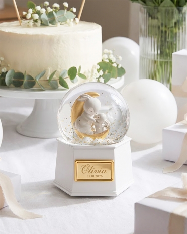 Snøkulelampe som snurrer og spiller en melodi, med personlig navn og dato