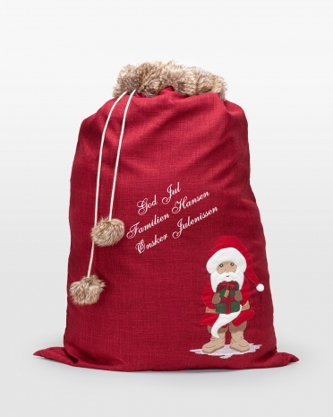 Rød julegavesekk med personlig hilsen, perfekt for unike julegaver og festlig oppbevaring.