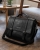 Svart laptopveske med brodert navn