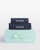 Håndklesett i marineblått med hvitt broderi