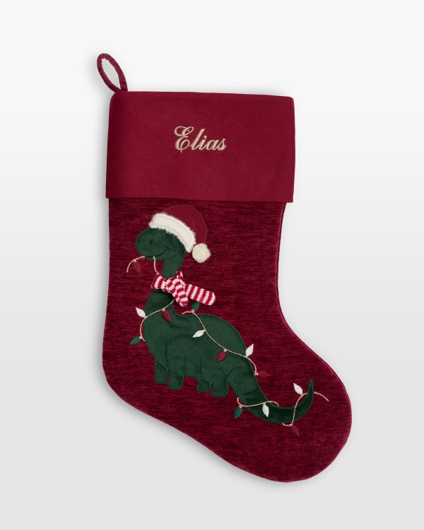 Julestrømpe med brodert navn og motiv av en julete dinosaur