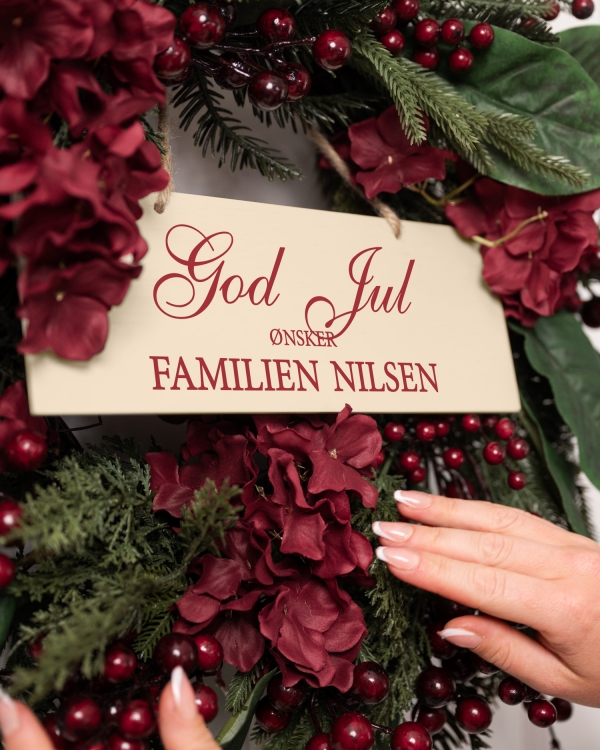 Skilt med julehilsen og navn