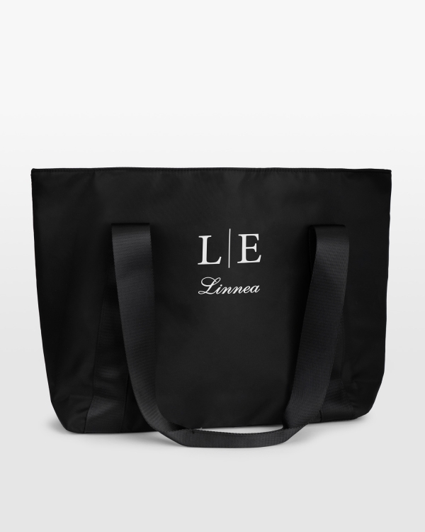 Romslig treningsbag med navn