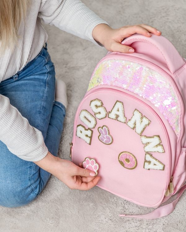 Stoffmerker å feste på barneryggsekk